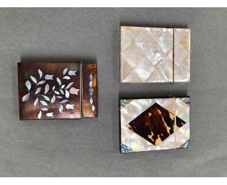 TWO MOTHER OF PEARL MOUNTED CARD CASES, AND AN INLAID TORTOISESHELL EXAMPLE. 