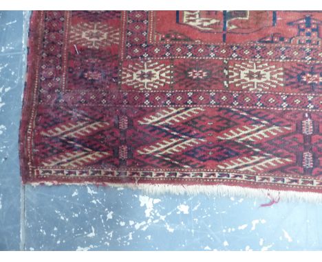 AN ANTIQUE TURKISH PRAYER RUG OF CLASSIC DESIGN 146 x 112cm. TOGETHER WITH A TEKKE BOKHARA RUG 177 x 116 (2)