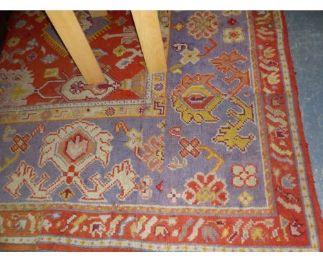 AN ANTIQUE TURKISH OUSHAK CARPET (REJOINED AND ALTERED IN SIZE) 448 x 325cm