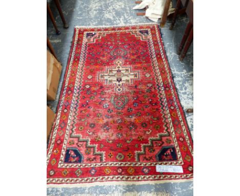 A PERSIAN TRIBAL RUG 202 x 133 cm TOGETHER WITH A TIBETAN RUG 182 x 96cm (2)