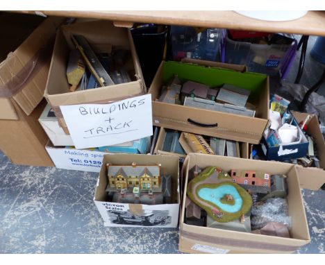 A LARGE COLLECTION OF VINTAGE MODEL RAILWAY TRACK SIDE BUILDINGS AND TRACK.