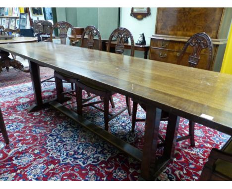 AN ARTS AND CRAFTS STYLE OAK REFECTORY TABLE ON DOUBLE SQUARE PILLAR END SUPPORTS. W 271 X D 62 X H 76cms.