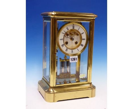 A MANTEL CLOCK IN GLAZED BRASS CASE STRIKING ON A BELL, THE PENDULUM MERCURY COMPENSATED, THE CIRCULAR DIAL WITH THE OPEN BRO