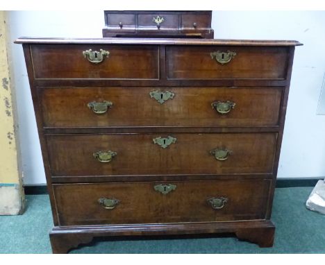 AN 18th C. HERRING BONE BANDED WALNUT CHEST OF TWO SHORT AND THREE LONG DRAWERS ON BRACKET FEET.   W 94 x D 51 x H 87cms.