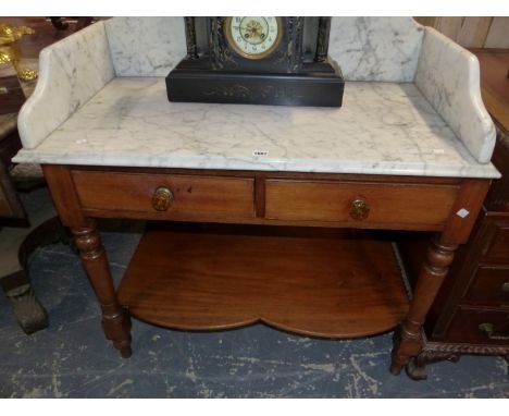 A WHITE MARBLE TOPPED MAHOGANY WASH STAND WITH TWO DRAWERS ABOVE THE TAPERING CYLINDRICAL LEGS JOINED BY AN OPEN SHELF.