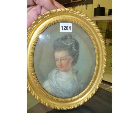 AN OVAL PASTEL PORTRAIT OF A GEORGIAN LADY WEARING PEARLS IN HER DARK HAIR, THE BACK INSCRIBED IN INK PORTRAIT OF CHARLES LAM
