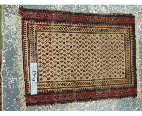 AN ANTIQUE PERSIAN TRIBAL RUG. 160 x 112cm TOGETHER WITH BELOUCH MAT, 112 x 79cm AND TWO TRIBAL BAG FACES (4)