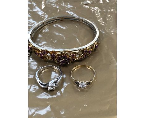 A VINTAGE DECORATIVE GILT PINK STONE SET BANGLE, AND TWO RINGS, ONE 9ct GOLD THE OTHER SILVER. 