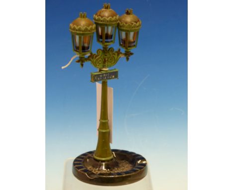 A CORDAY SCENT BOTTLE HOLDER AND ASHTRAY MODELLED AS A THREE LIGHT STREET LAMP FROM RUE DE LA PAIX.   H 21cms.