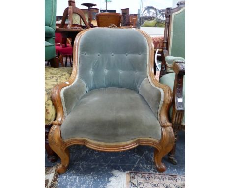 A VICTORIAN WALNUT HOOP BACK SHOW FRAME ARMCHAIR BUTTON UPHOLSTERED IN GREY VELVET, THE KNEES OF THE&nbsp;CABRIOLE LEGS HUSK 
