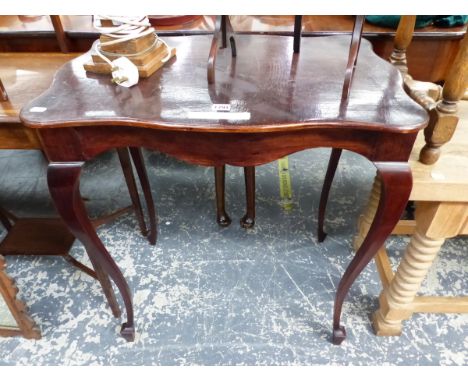 A MAHOGANY THREE TIER CAKE STAND, A ROSEWOOD CANDLESTICK TABLE LAMP AND A WAVY RECTANGULAR TOPPED MAHOGANY TABLE ON CABRIOLE 