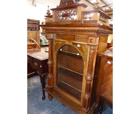 A VICTORIAN WALNUT GLAZED CABINET FORMERLY HOUSING A POLYPHON MUSIC DISC PLAYER. W 79 X D 41 X H 147CMS.