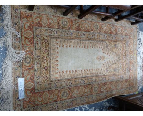A TURKISH PRAYER RUG OF CLASSIC DESIGN.  185 x 118cm