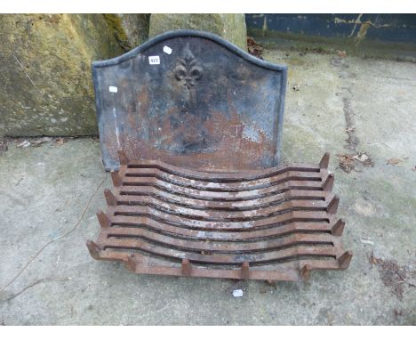 A CAST IRON FIRE BACK AND GRATE.