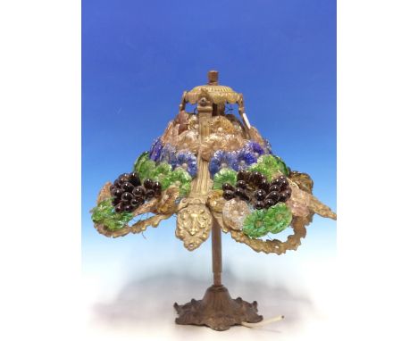 A TABLE LAMP AND A CEILING LIGHT SHADE BOTH MOUNTED WITH ROWS OF INDIVIDUAL COLOURED GLASS FLOWER HEADS AND WITH BUNCHES OF G