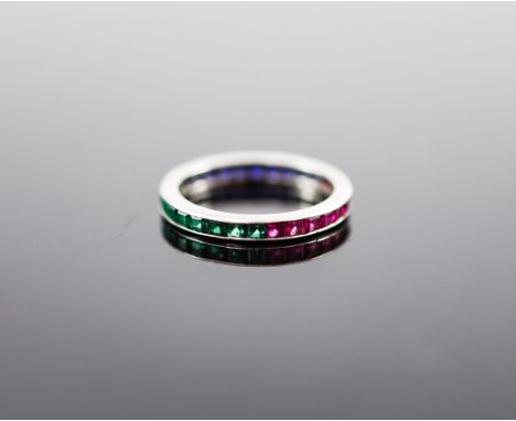   A platinum? ruby, emerald and sapphire set full eternity ring,size M, gross weight 1.6 grams.