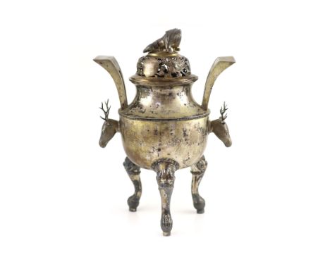   An early 20th century Chinese Export silver two handled koro and cover,with stag head handles and pierced cover with lion f