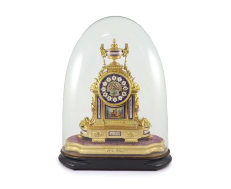   A 19th century French ormolu and Sevres style porcelain mantel clockof architectural form with urn finial and jewelled cher