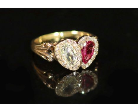   A 19th century gold two stone pear cut ruby and diamond set ring,with rose cut diamond set borders, in a twin heart shaped 