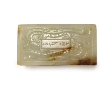   A Chinese archaistic white and brown jade box and cover,the cover carved in low relief with an inscription and a pair of ch