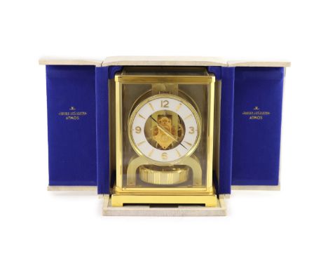   A Jaeger le Coultre Atmos clockwith lacquered gilt case and Arabic/ baton dial, movement no.307442, with travelling case an