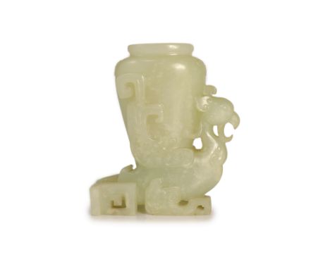   A Chinese archaistic pale celadon jade 'phoenix' vase, 18th/19th century,carved as a phoenix with geometric scrolling wings