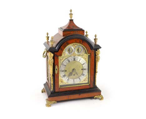   A late Victorian faux tortoiseshell and ebonised mantel clockwith brass dial to striking and chiming movement with floral s