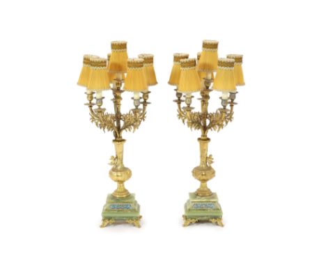   A pair of elaborate gilt metal and green onyx six-light candelabra table lamps on pedestal urn supports incorporating champ