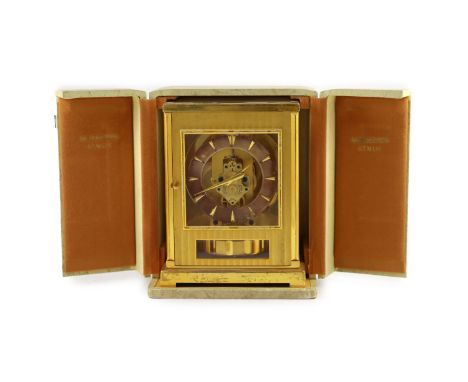   A Jaeger le Coultre Atmos clockIn lacquered gold case with silvered dial and Arabic numerals, movement no. 63470, with trav
