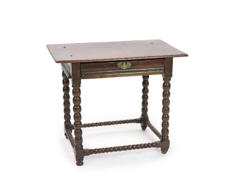   A Charles II rectangular oak side tablewith rectangular top and moulded freeze draw on bobbin turned underframeH 76cm. W 89