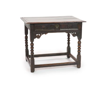   A Charles II oak side tablewith moulded rectangular top and panelled freize drawer, on Bobbin turned legs with all round st