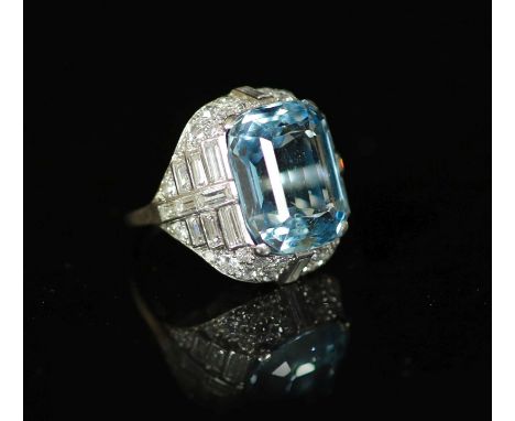   A 1930's/1940's platinum?, emerald cut aquamarine, round and baguette cut diamond set dress ring,the aquamarine measuring a