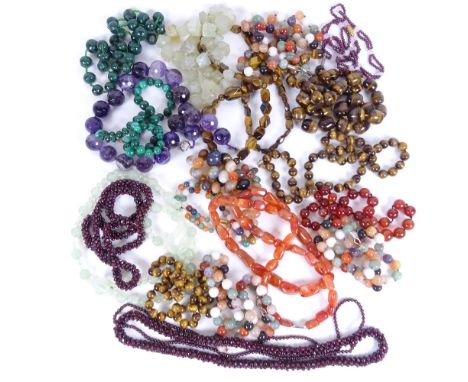 A collection of necklaces, to include tigers eye, malachite, amethyst, carnelian, jade and garnet 