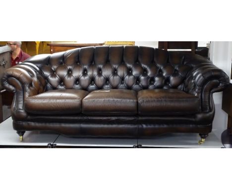 A brown leather button-back upholstered 3-seater sofa, with rollover arms, by Thomas Lloyd, L216cm, H95cm, seat height 45cm, 