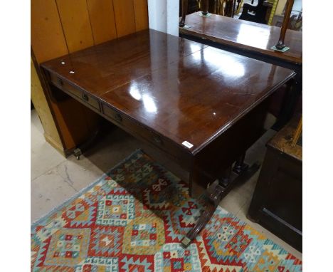 A Regency ebony-strung mahogany sofa table, with opposing drawers, raised on quadruple turned legs, W115cm, H76cm 