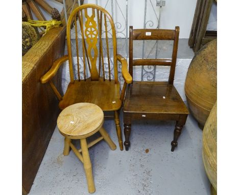 An Ercol wheel-back elbow chair, an Antique oak chair, and a pine stool 