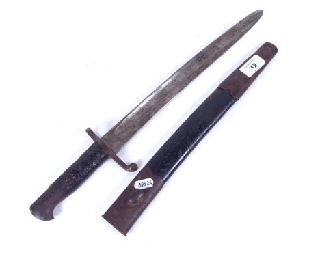 A British military sword bayonet, circa 1900, original brass-mounted leather scabbard, blade length 33.5cm 