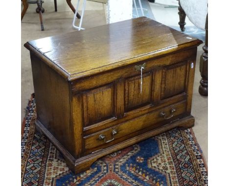 A Titchmarsh &amp; Goodwin Ipswich oak TV stand, with panelled fall-front, on bracket feet, W67cm, H46cm, D42cm 