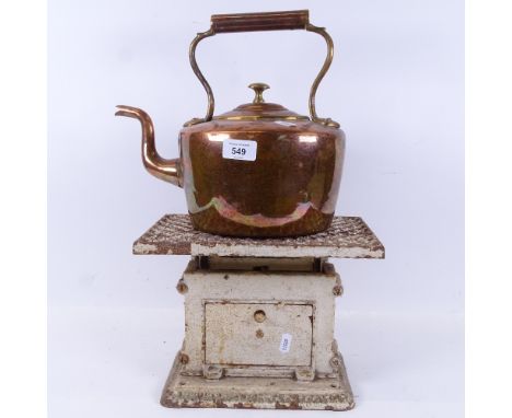 A Victorian copper kettle, height 26.5cm, and a Vintage cast-iron bathroom scale 