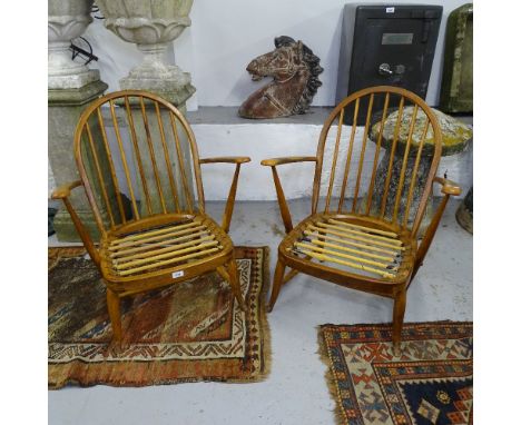A pair of mid-century Ercol stick-back low armchairs (no cushions) 