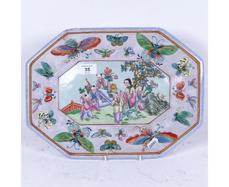 A Chinese octagonal hand painted ceramic plate, with butterfly surround and mark underneath, length 36.5cm 