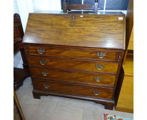 A George III mahogany bureau, the fall-front revealing a drawer and pigeon hole fitted interior, 4 drawers under, on bracket 