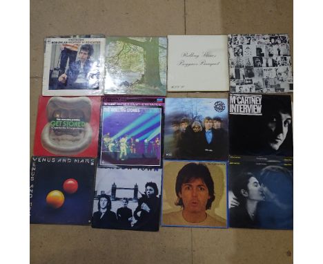 Various vinyl LPs and records, including the Rolling Stones, Bob Dylan, and John Lennon 