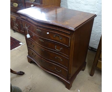 A reproduction crossbanded mahogany bachelor's chest of serpentine form, with brushing slide and 4 long drawers under, on bra