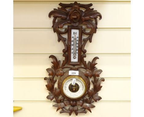 A Swiss carved oak-framed barometer and thermometer, by E Dietzsch of Zurich, height 46cm 