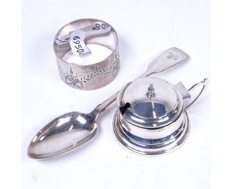 A small silver mustard pot with blue liner, engraved silver napkin ring and a silver teaspoon 