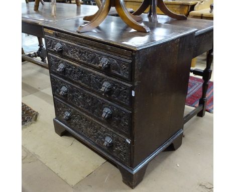 An Antique oak chest, with brushing slide, 4 long drawers under with lion mask handles, on bracket feet, W76cm, H76cm, D50cm 