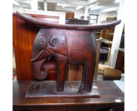 An Ashanti style stool with elephant support, W53cm, H52cm 