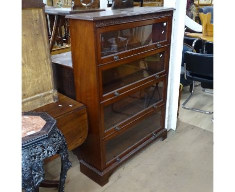An Edwardian mahogany bookcase, with 4 glazed doors, on bracket feet, W100cm, H137cm, D31cm 