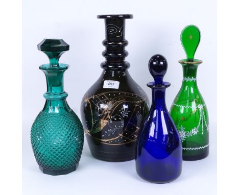 A large gilded green glass decanter, a smaller example with stopper, a Bristol blue glass decanter and stopper etc, largest h